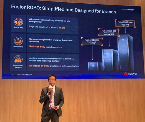 A Huawei executive giving a FusionROBO for enterprise branch management presentation at the solution launch