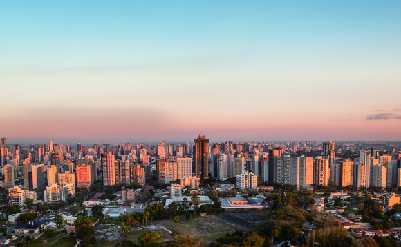 An aerial view of the Curitiba City, Brazil, at sunset in an article on digital transformation by Huawei partner Compwire