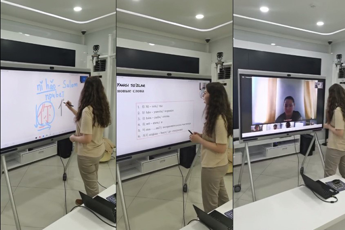 A young student in Uzbekistan using the HUAWEI IdeaHub in the classroom to participate in remote learning