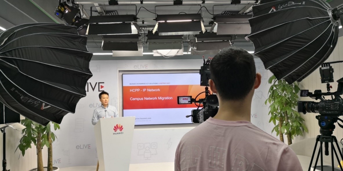 A Huawei representative speaks to the camera on the set of a live webcast during the online Partner Elite Training Camp 2020