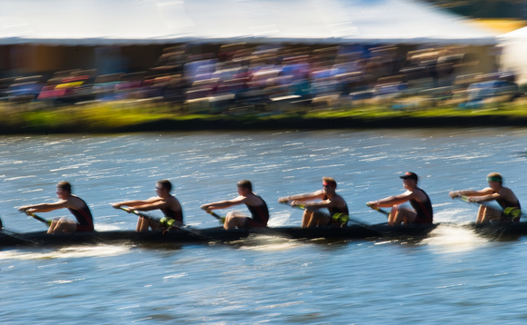 A blurry eight rowing boat racing on water at speed, representing the growing numbers of Huawei ecosystem partners