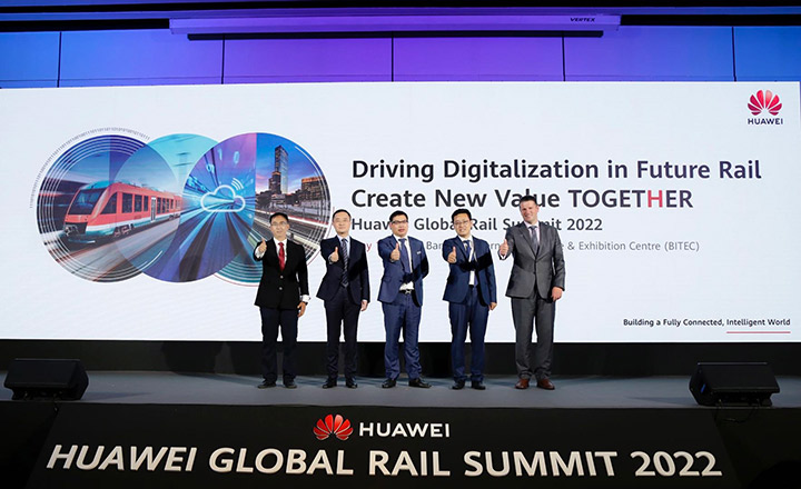 A group of Huawei executives on stage giving the thumbs up at the Huawei Global Rail Summit 2022