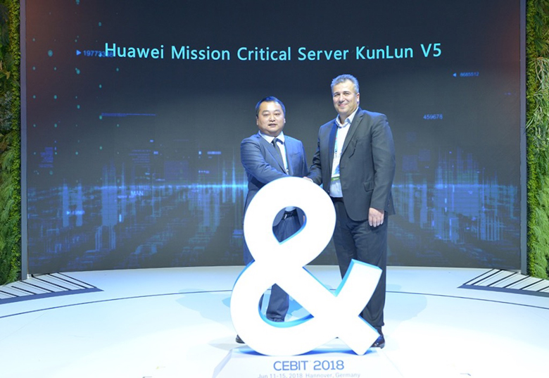 Huawei's Matt Zhou and SUSE's Naji Almahmoud shake hands and release the KunLun V5 Mission Critical Server at CeBIT 2018