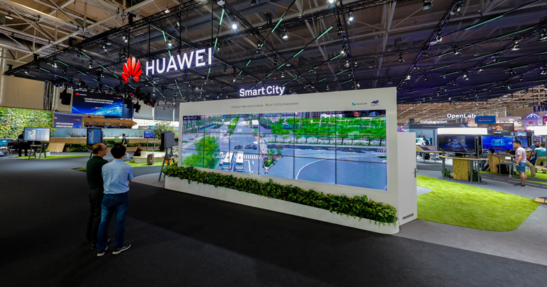 Visitors observing the Huawei Smart City booth at CeBIT 2018