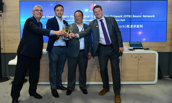 Representatives from Huawei and Shanghai Shentong Metro Group toast the world's first OTN commercial case for urban rail