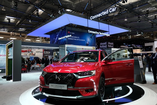 A red DS 7 CROSSBACK automobile with Huawei's connected car technology at the company's booth at HANNOVER MESSE 2018